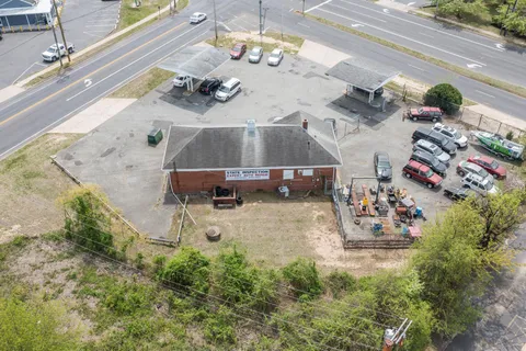 an aerial view of a house with a garden and barbeque oven