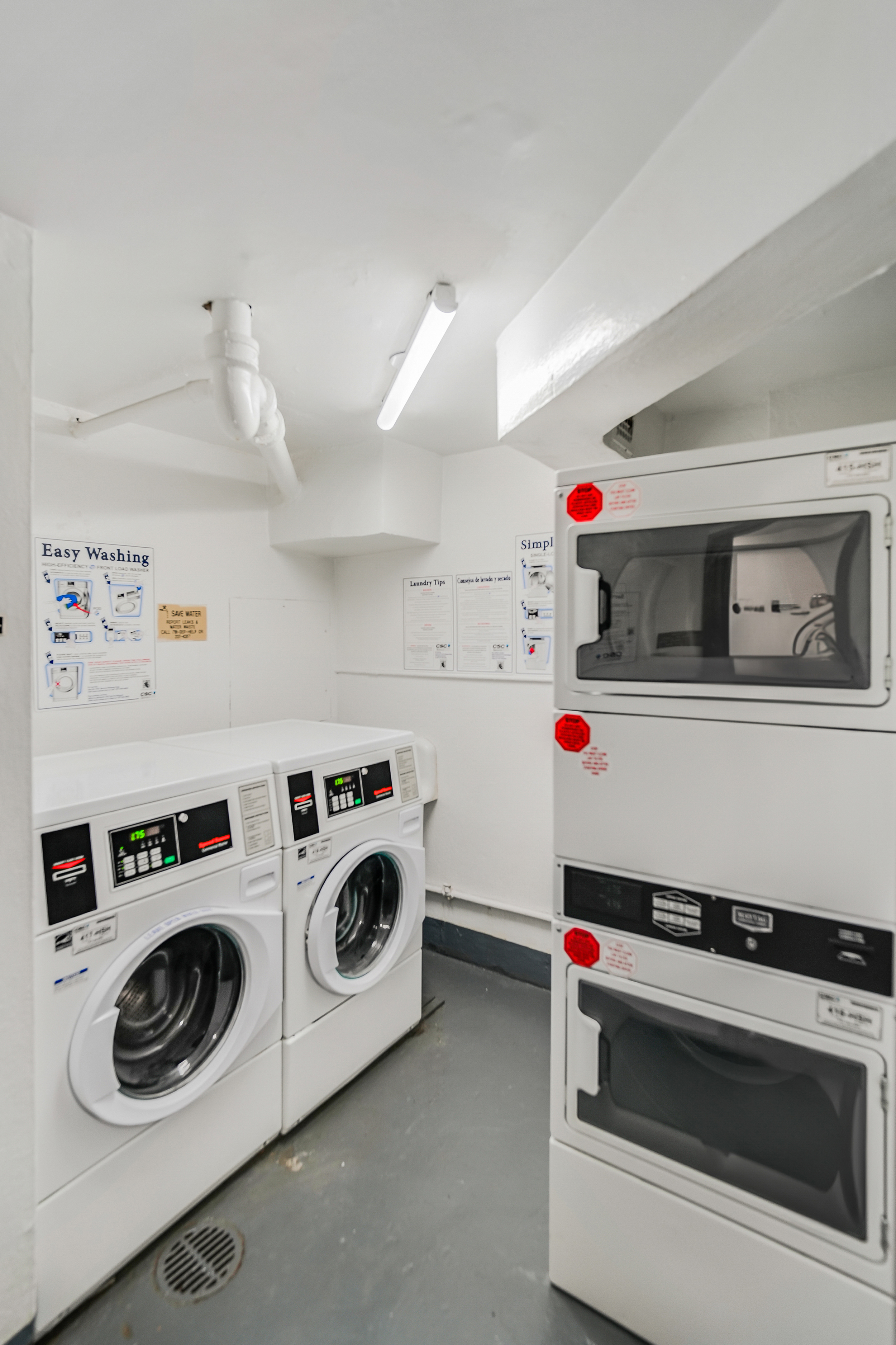 301 East 69th Street, Unit 3M Manhattan, NY 10021 - Photo 8 of 12 a utility room with dryer and washer