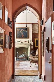 a view of living room with furniture and a fireplace