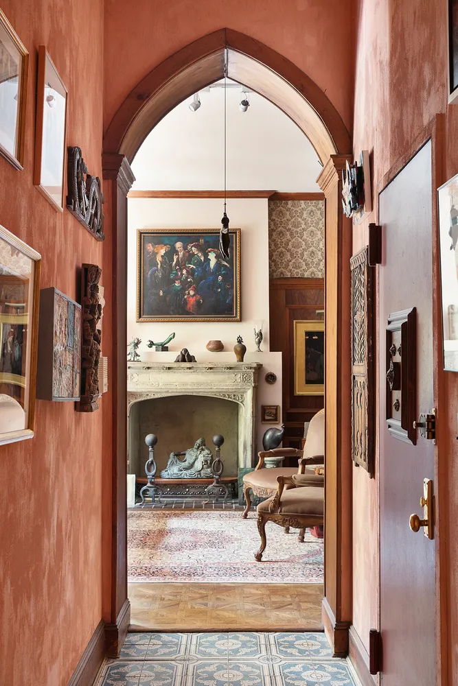 a view of living room with furniture and a fireplace