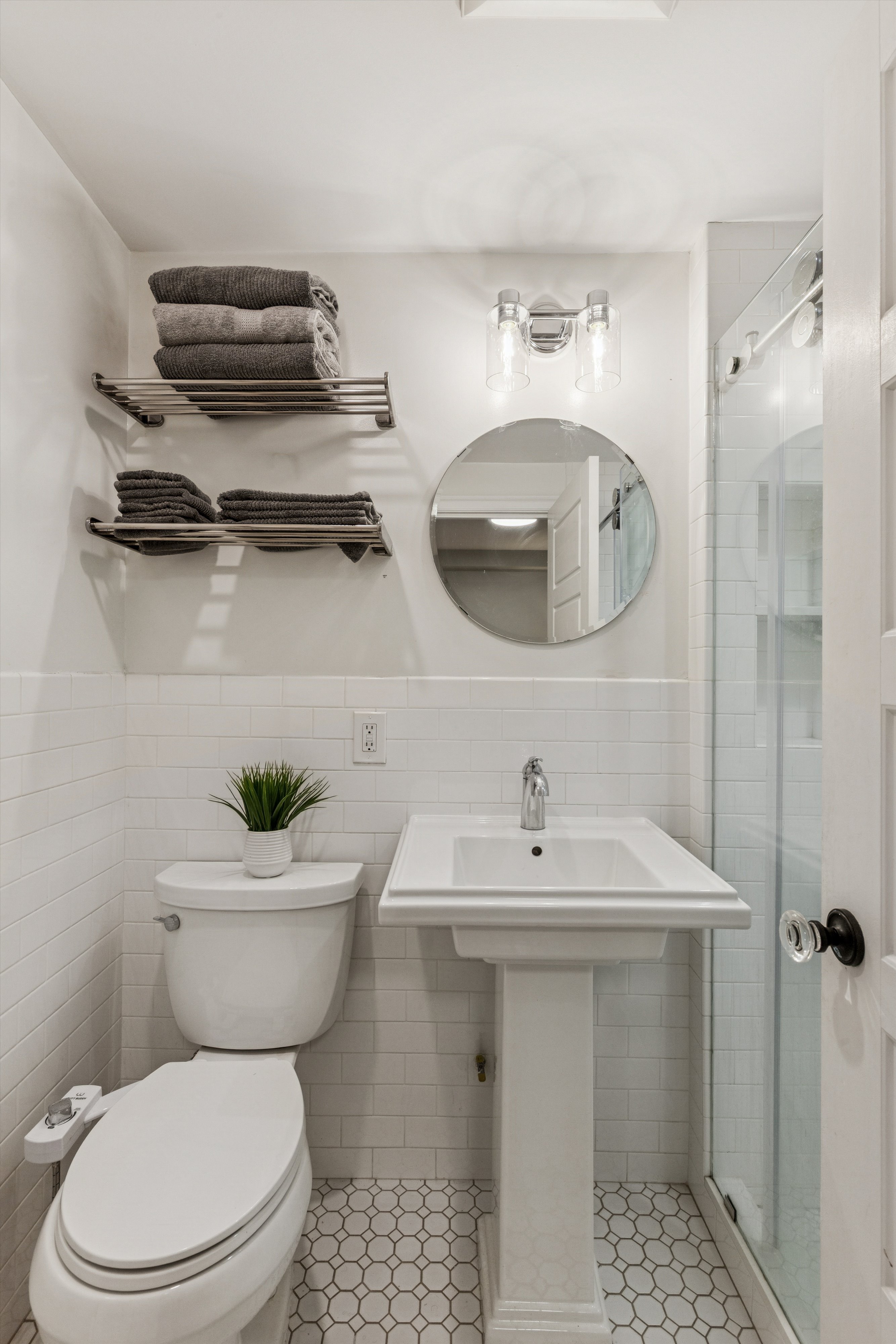 318 West 140th Street, Unit GARDEN Manhattan, NY 10030 - Photo 6 of 12 a bathroom with a sink a toilet and a mirror