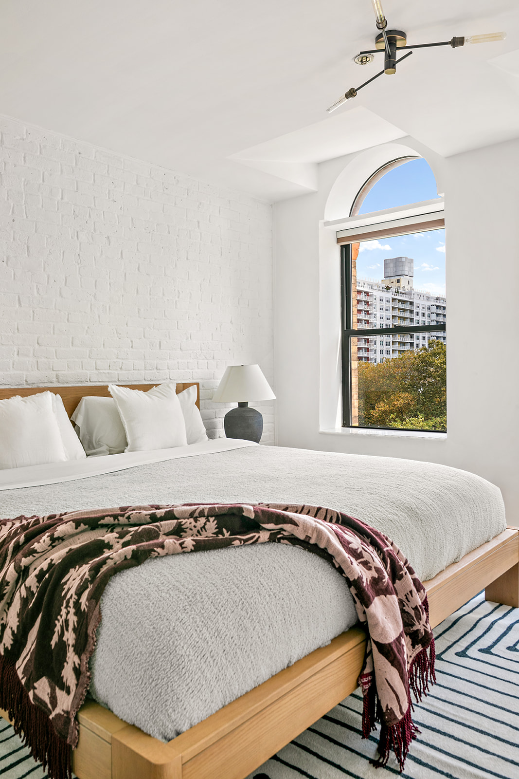 520 LaGuardia Place, Unit 6N Manhattan, NY 10012 - Photo 9 of 11 a bedroom with a bed and window