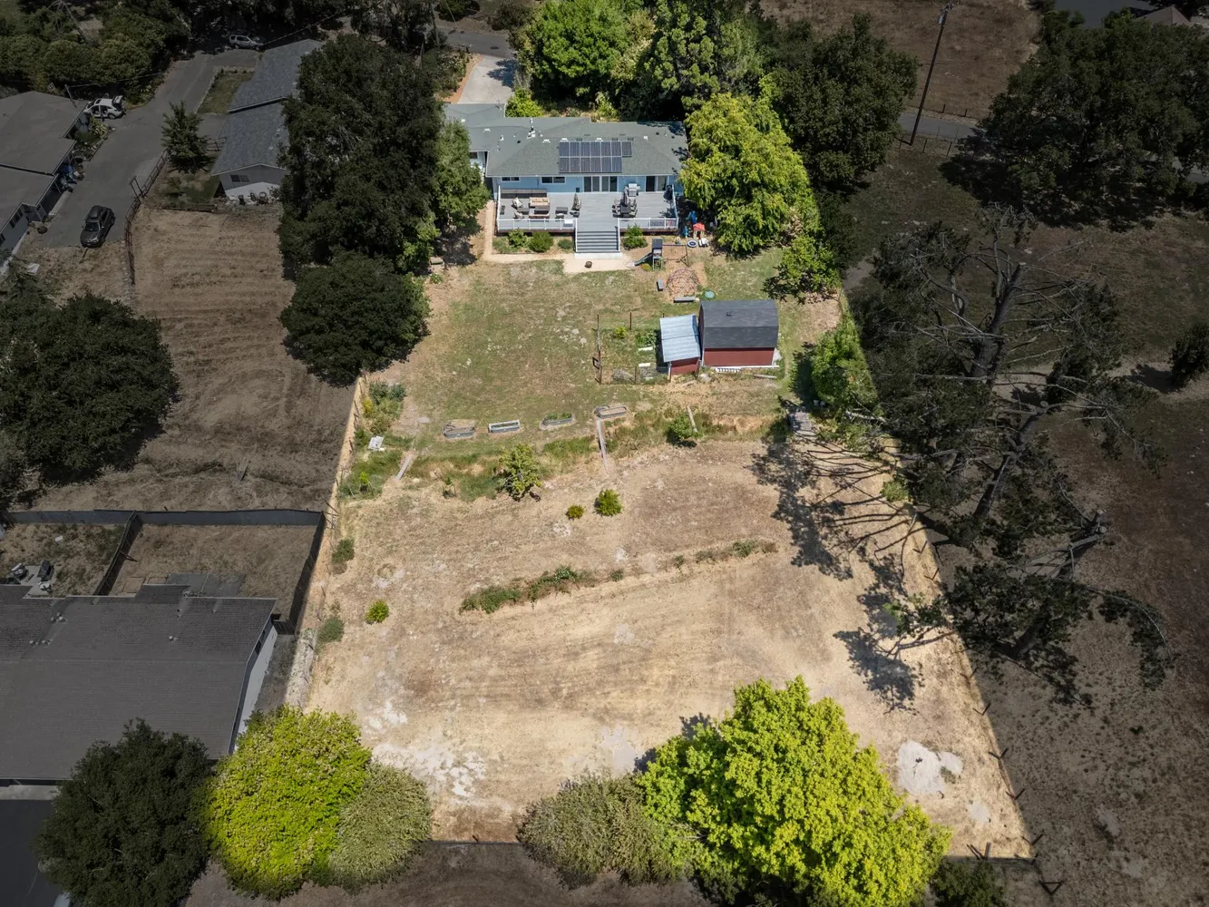 an aerial view of residential house with outdoor space