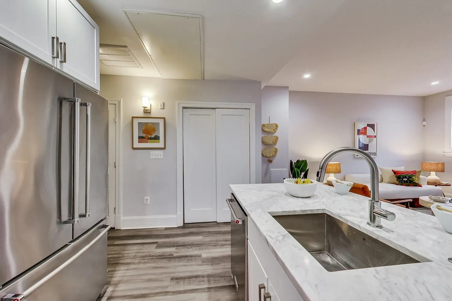 a kitchen with a sink and a refrigerator