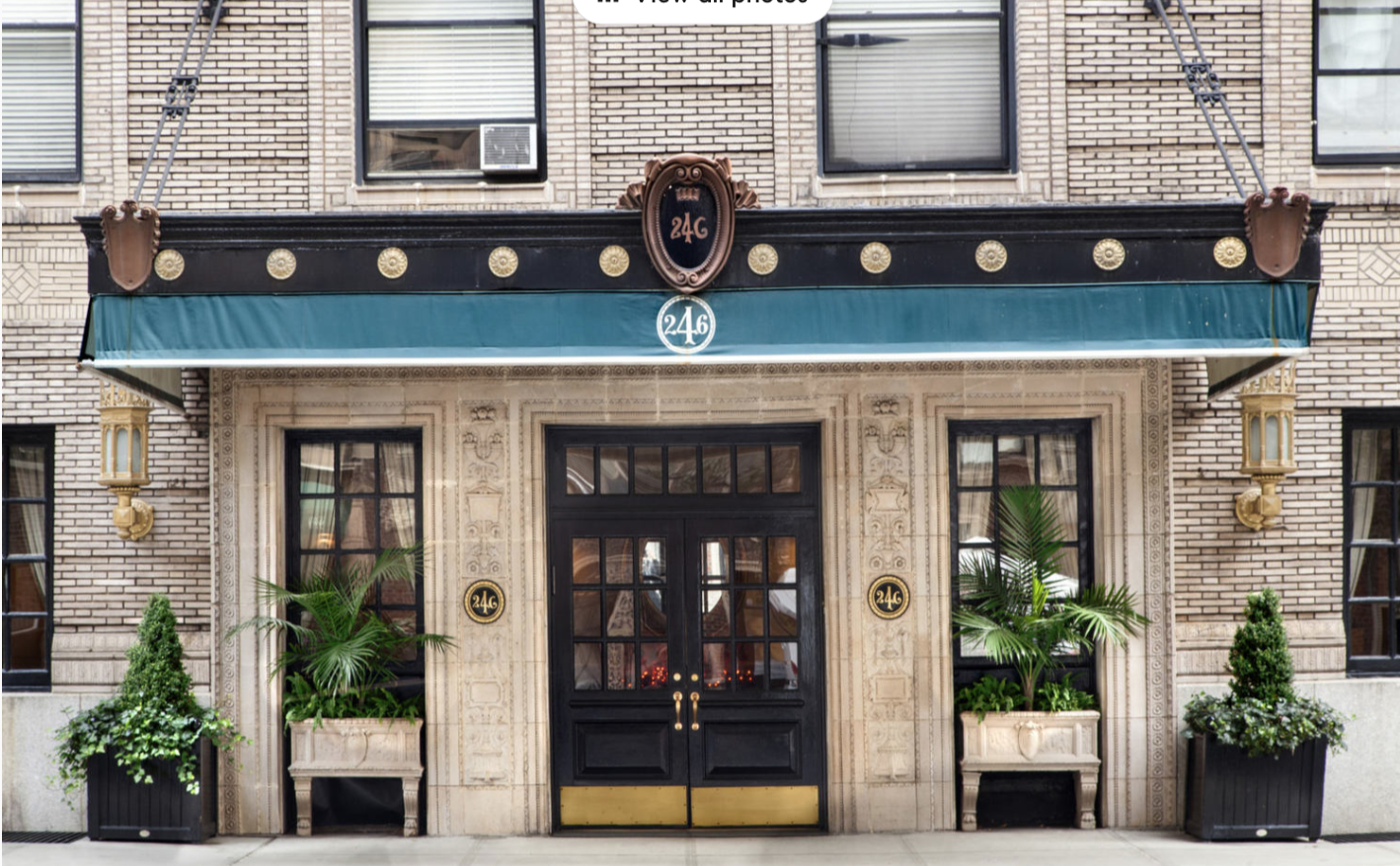 246 West End Avenue, Unit 9F Manhattan, NY 10023 - Photo 5 of 10 a front view of a building with potted plants