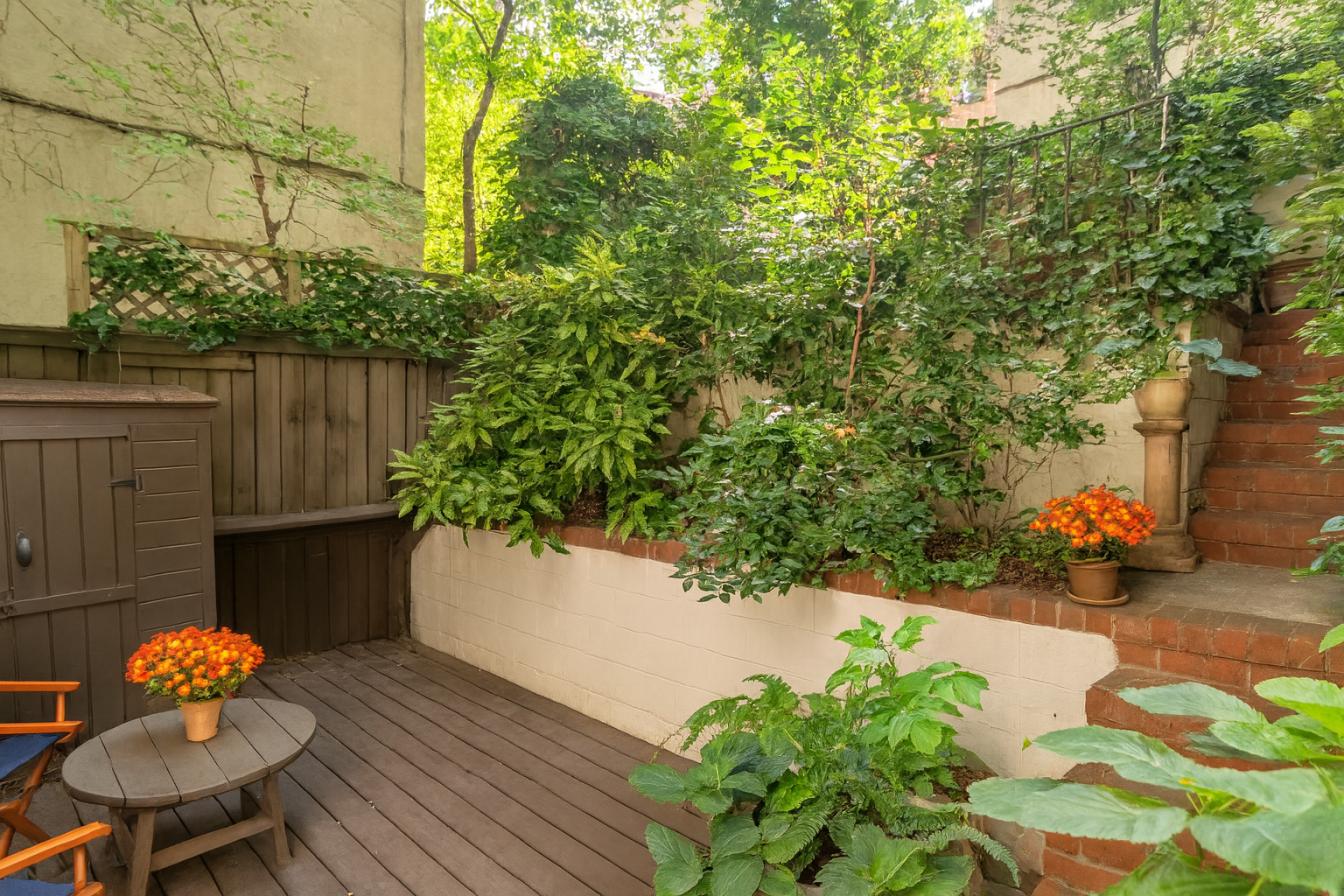 432 East 85th Street, Unit 1R Manhattan, NY 10028 - Photo 10 of 14 a front view of a house with a yard