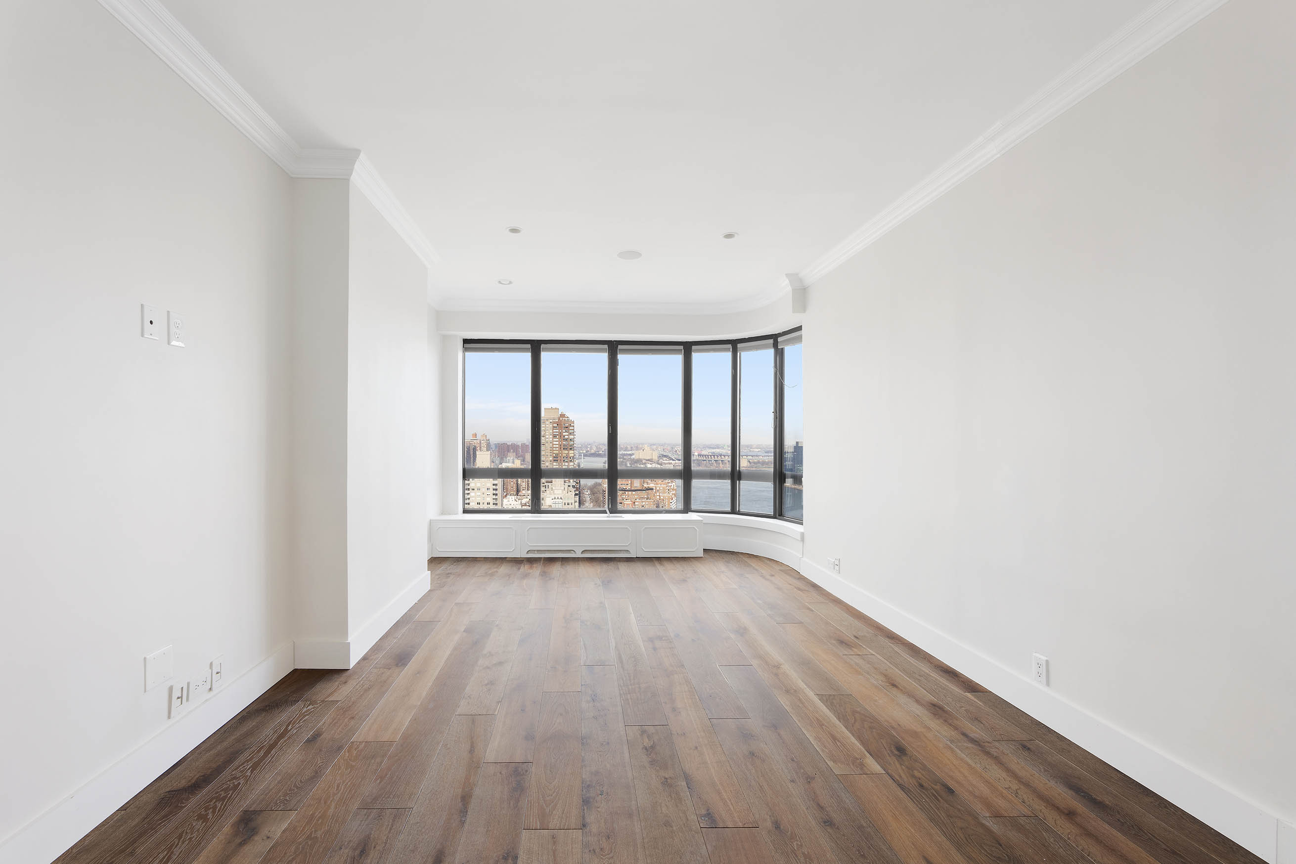 530 East 76th Street, Unit PH36/37E Manhattan, NY 10021 - Photo 15 of 29 wooden floor in an empty room with a window