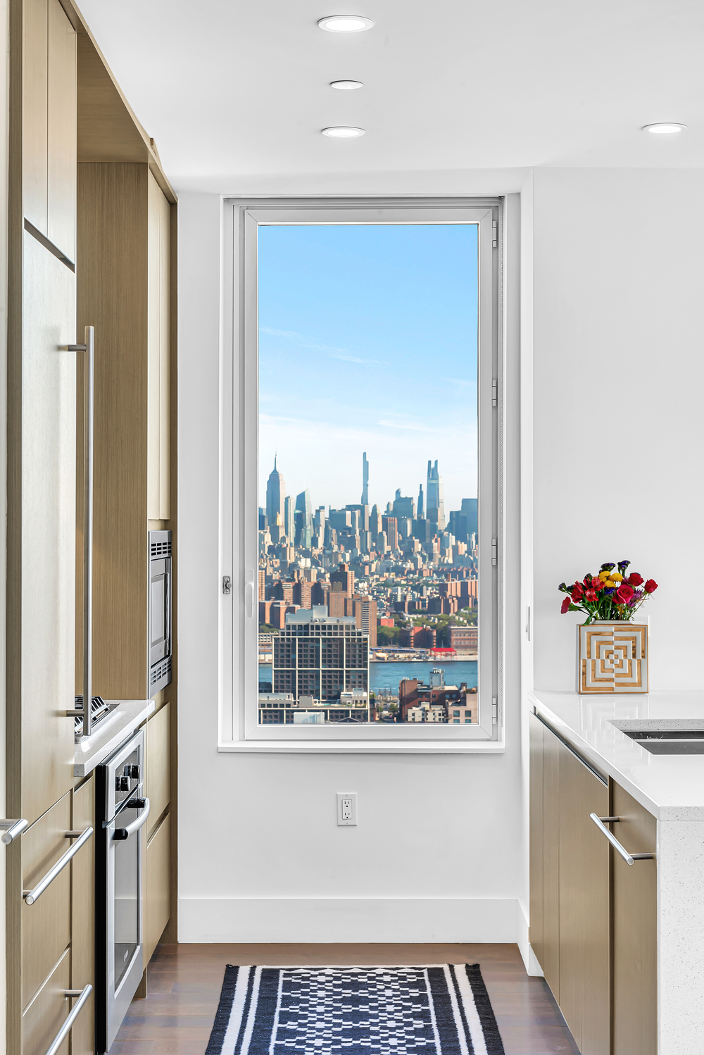 388 Bridge Street, Unit 42G Brooklyn, NY 11201 - Photo 2 of 26 a view of a kitchen with a sink and dishwasher