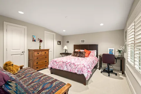 a bedroom with a bed and furniture