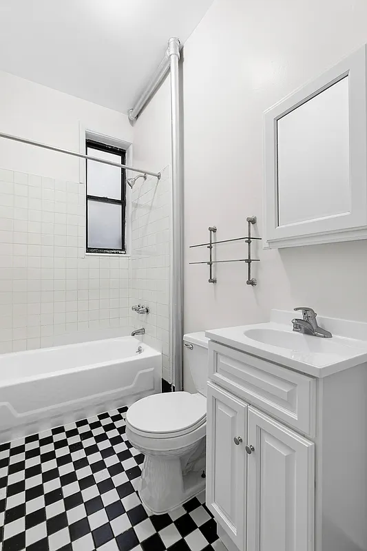 260 Gates Avenue, Unit 1C Brooklyn, NY 11238 - Photo 7 of 8 a bathroom with a sink a toilet and shower