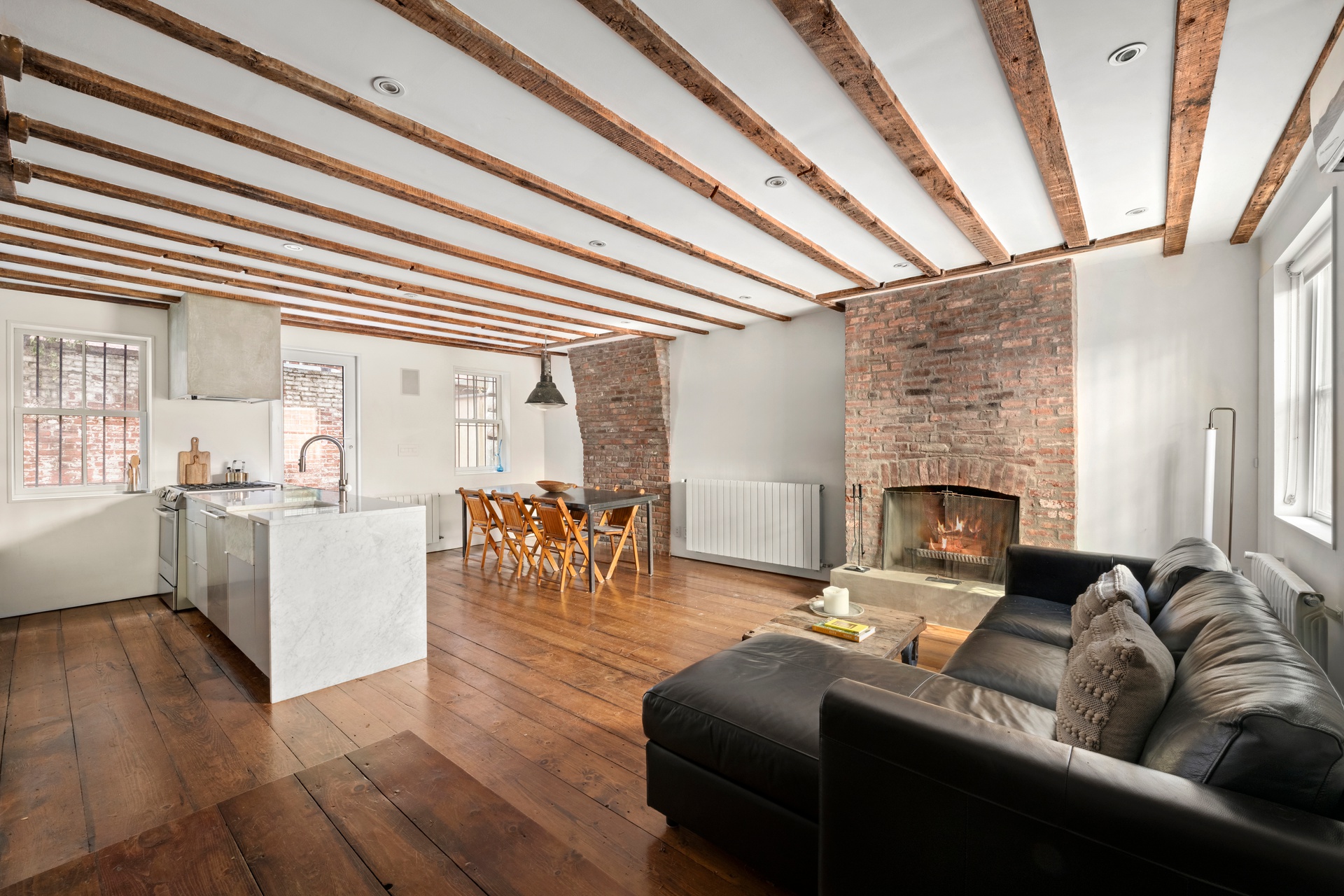 8 Sylvan Terrace Manhattan, NY 10032 - Photo 7 of 19 a living room with furniture and a fireplace