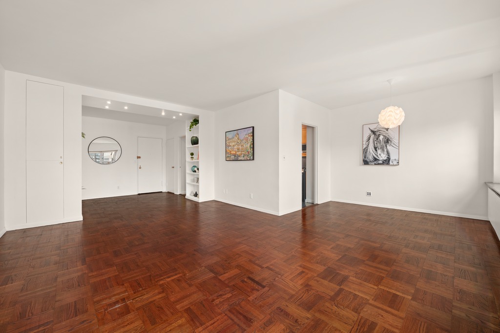 20 East 9th Street, Unit 12X Manhattan, NY 10003 - Photo 9 of 26 wooden floor in a empty room