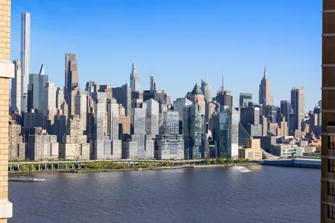 a view of a ocean with tall building