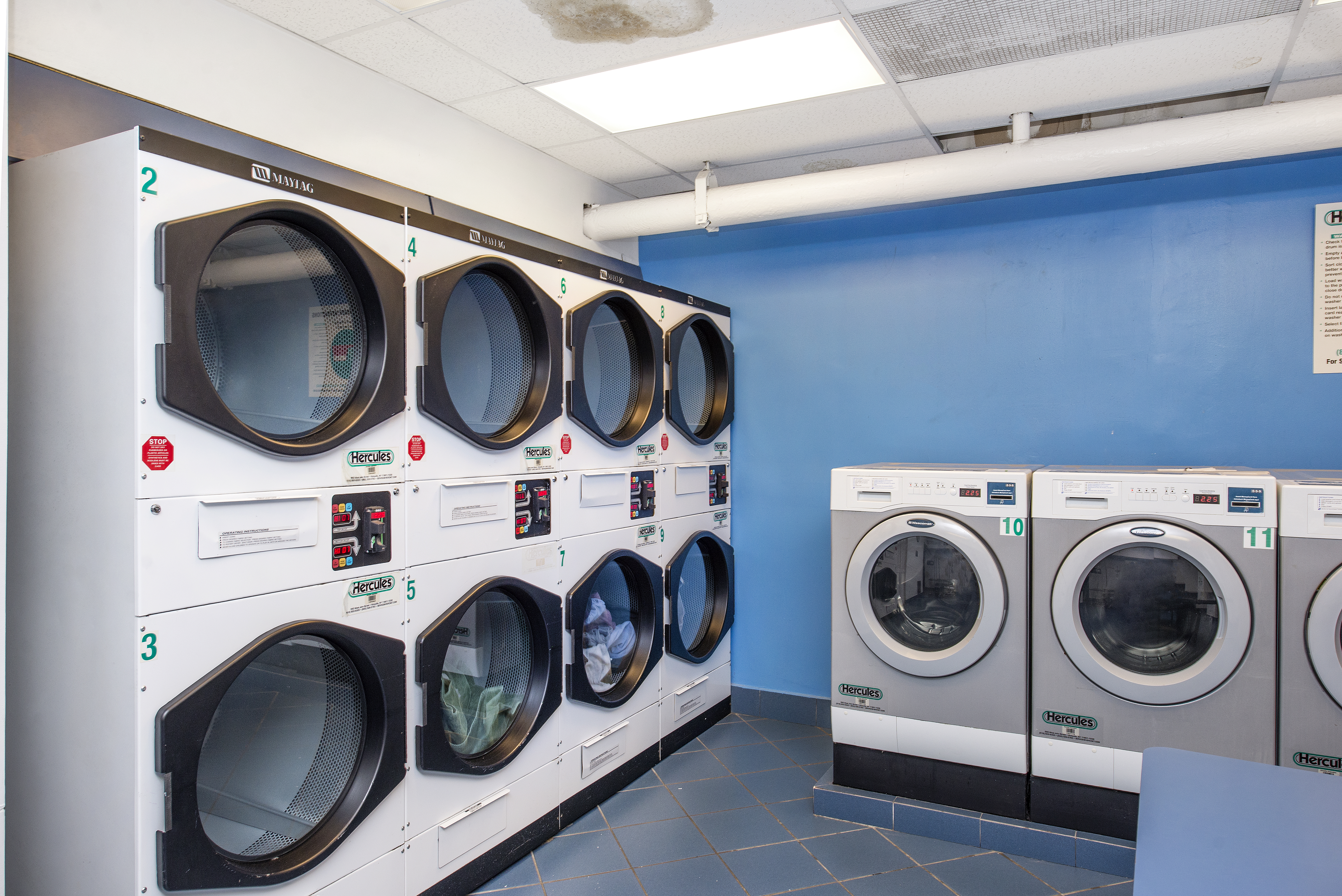 80 Park Avenue, Unit 9L Manhattan, NY 10016 - Photo 7 of 10 a utility room with dryer and washer
