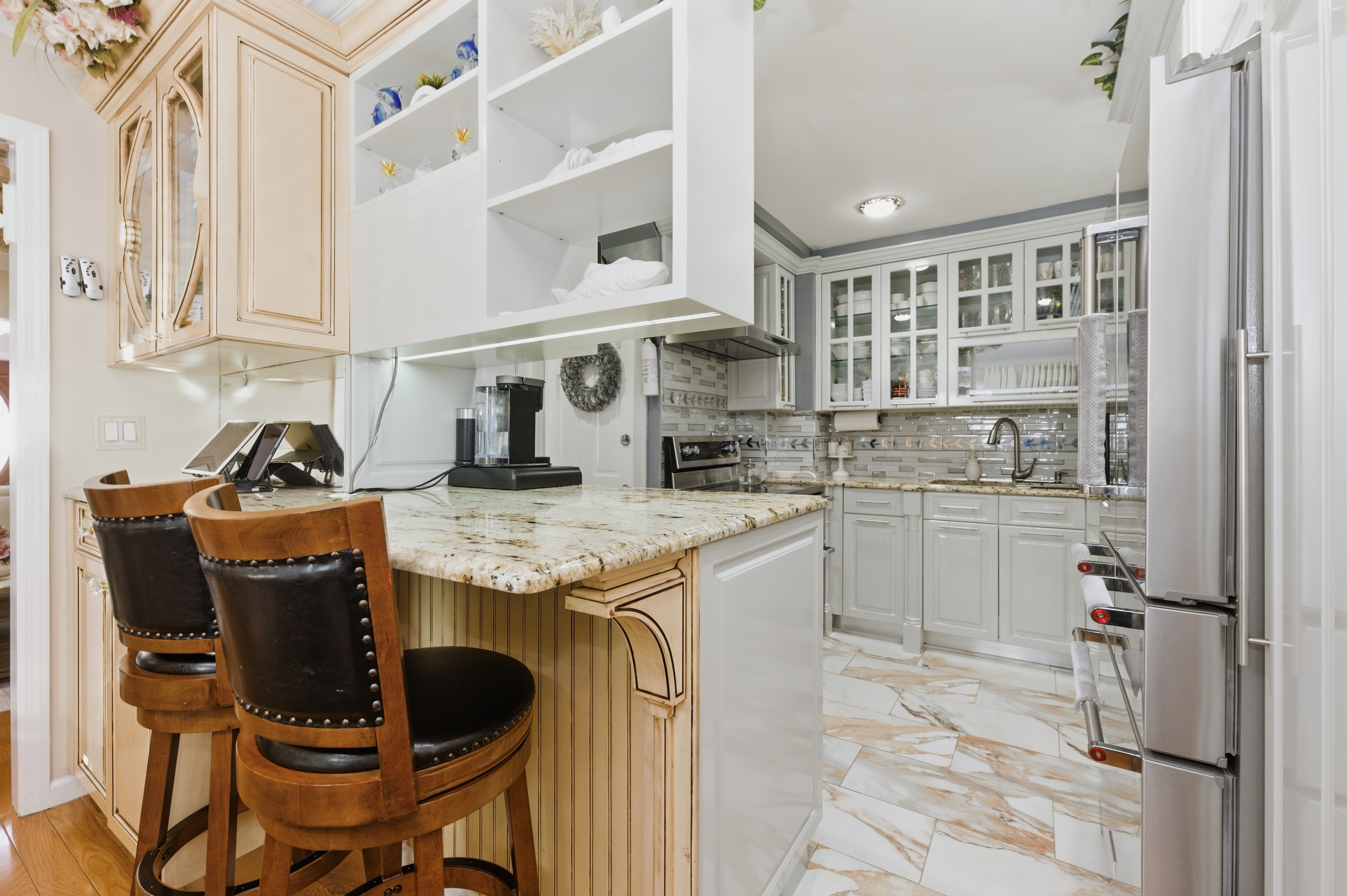 150-22 114th Road Queens, NY 11434 - Photo 8 of 22 a kitchen with cabinets and chairs