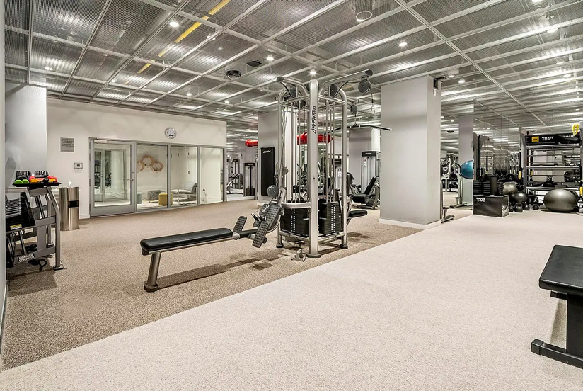 200 East 66th Street, Unit A407 Manhattan, NY 10065 - Photo 21 of 24 a view of a room with gym equipment