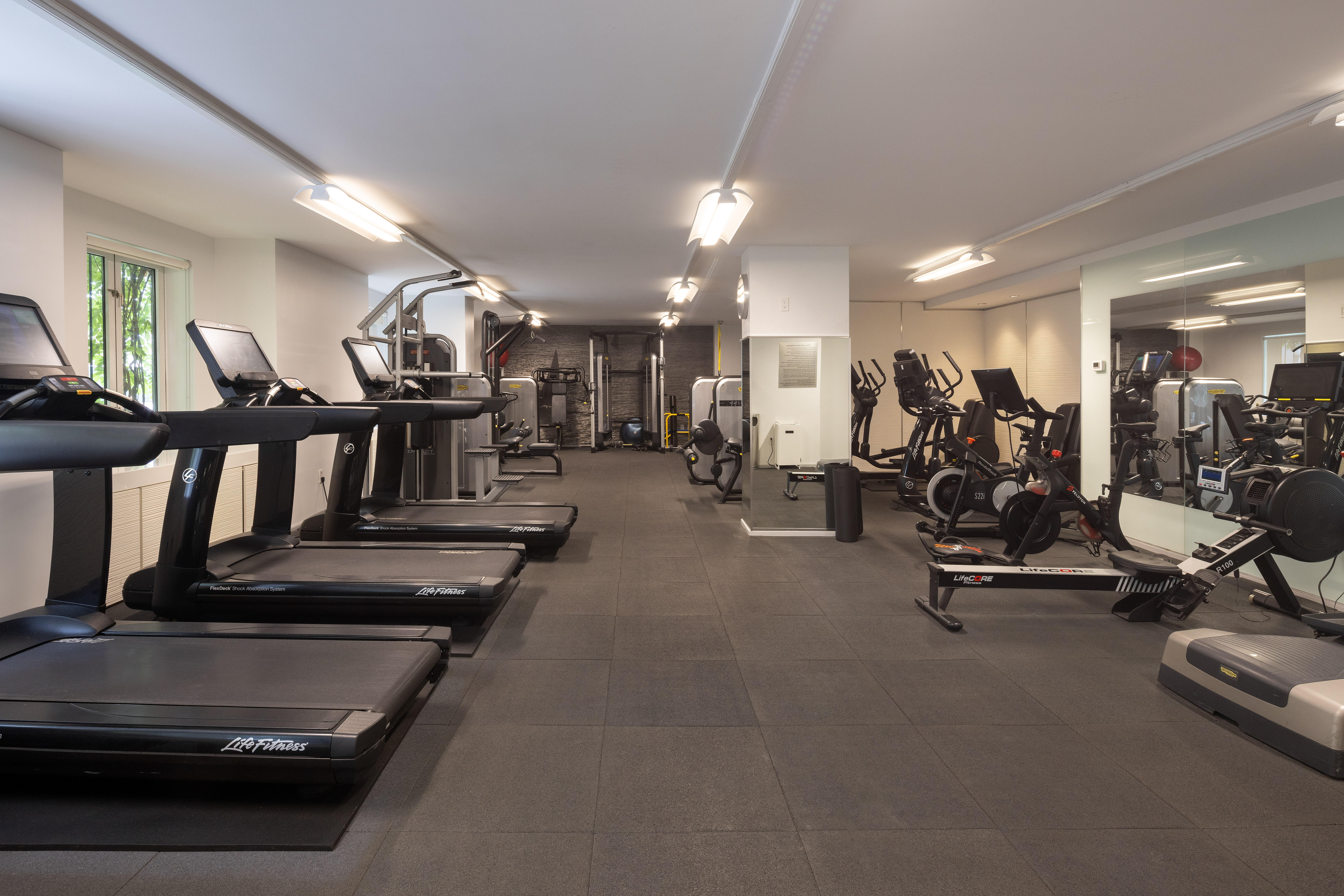 333 Rector Place, Unit 1401 Manhattan, NY 10280 - Photo 8 of 9 a view of a room with gym equipment
