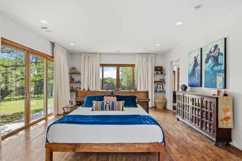 a living room with furniture and a floor to ceiling window