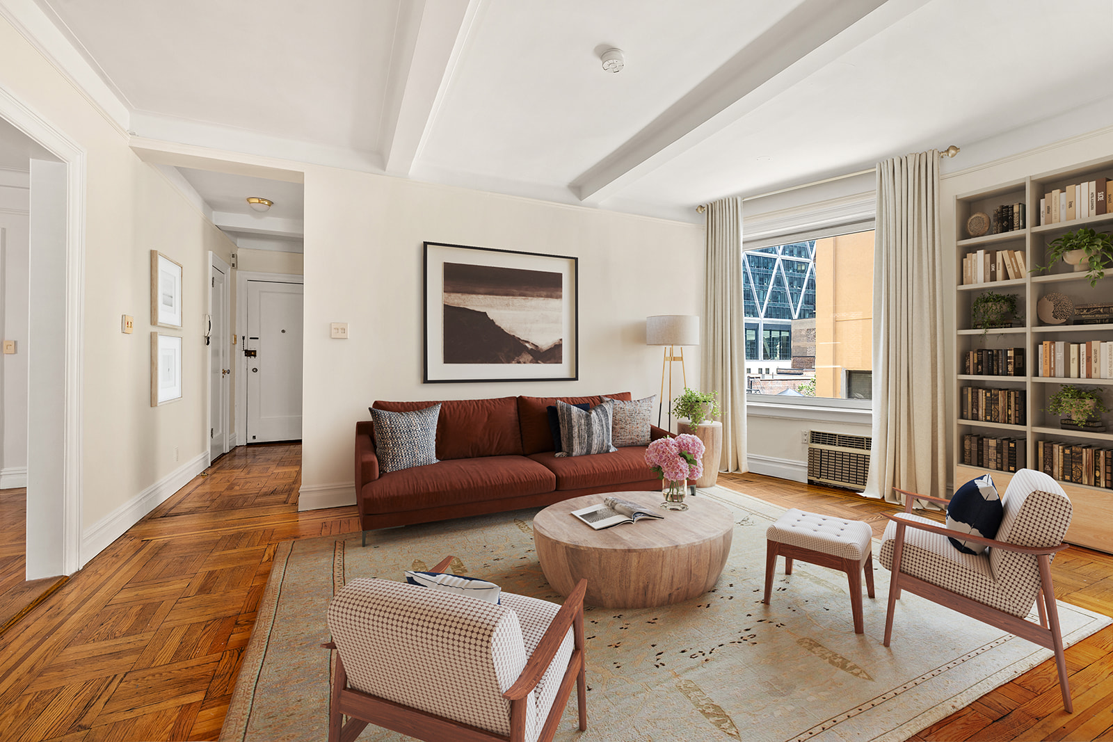 a living room with furniture and a large window
