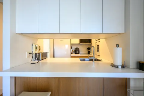 a kitchen with a sink and cabinets