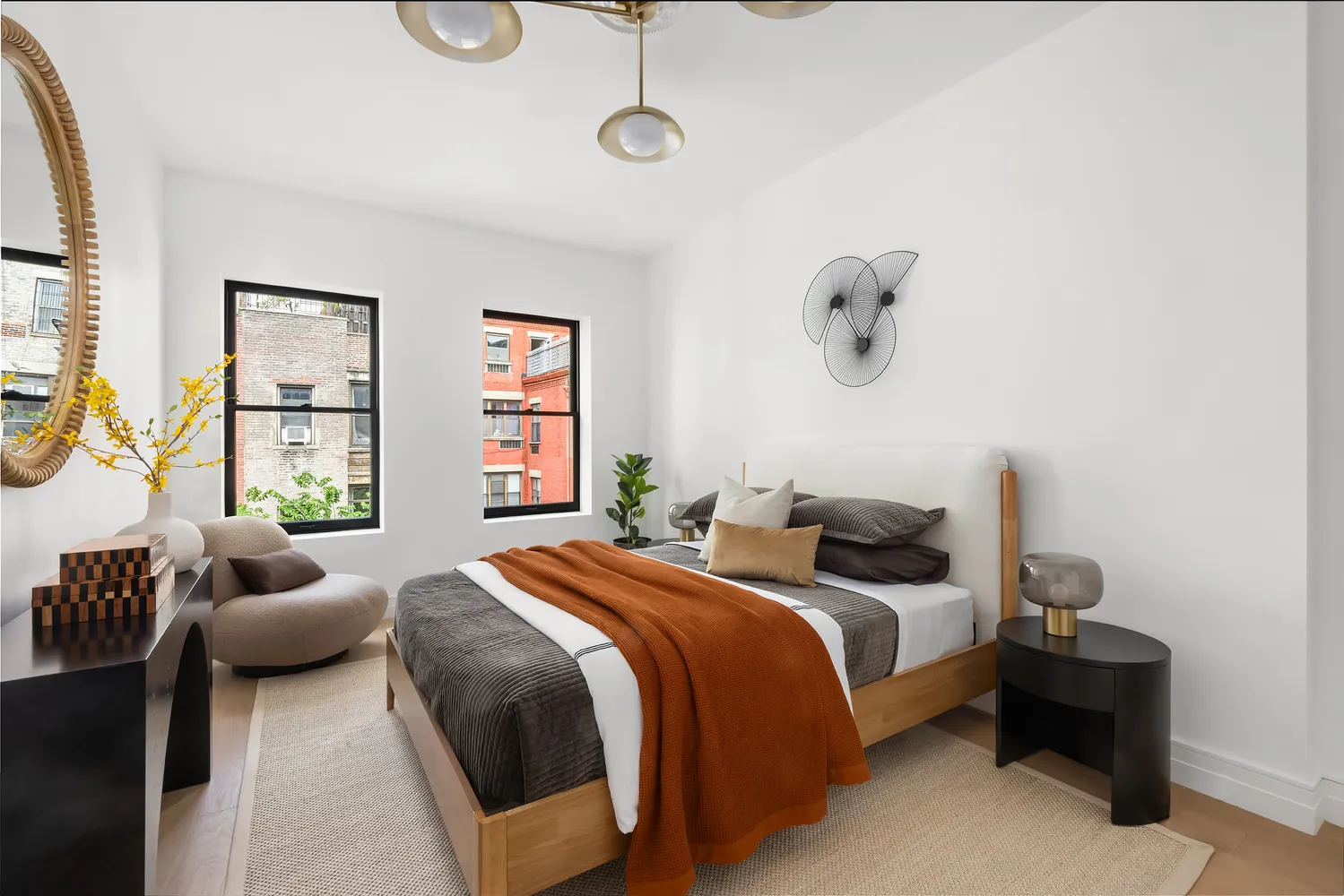 a bedroom with a bed couch and window