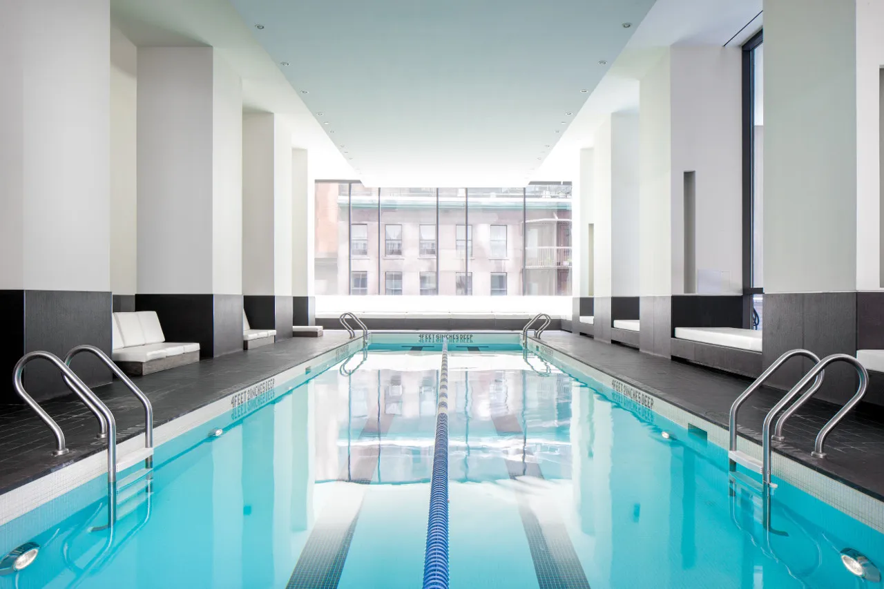 a room with gym equipment and a large window