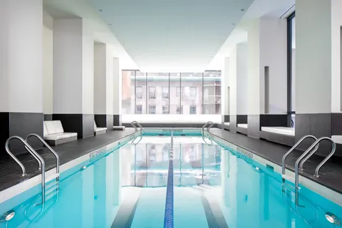 a room with gym equipment and a large window