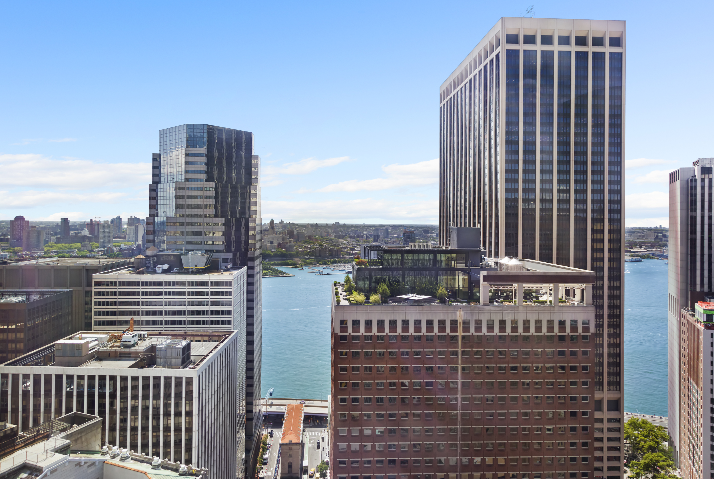15 William Street, Unit 40C Manhattan, NY 10005 - Photo 7 of 18 a view of a city with tall buildings