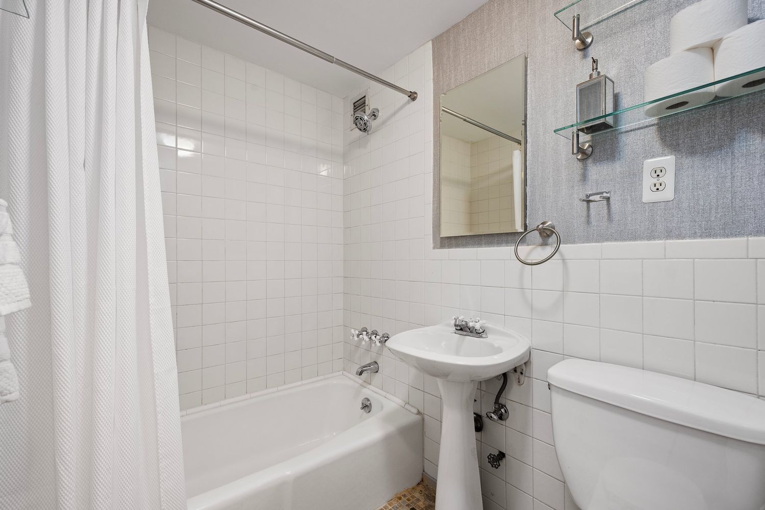 261 West 71st Street, Unit 1 Manhattan, NY 10023 - Photo 14 of 15 a bathroom with a sink a toilet and shower
