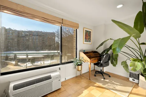a kitchen with stainless steel appliances granite countertop a stove and a microwave