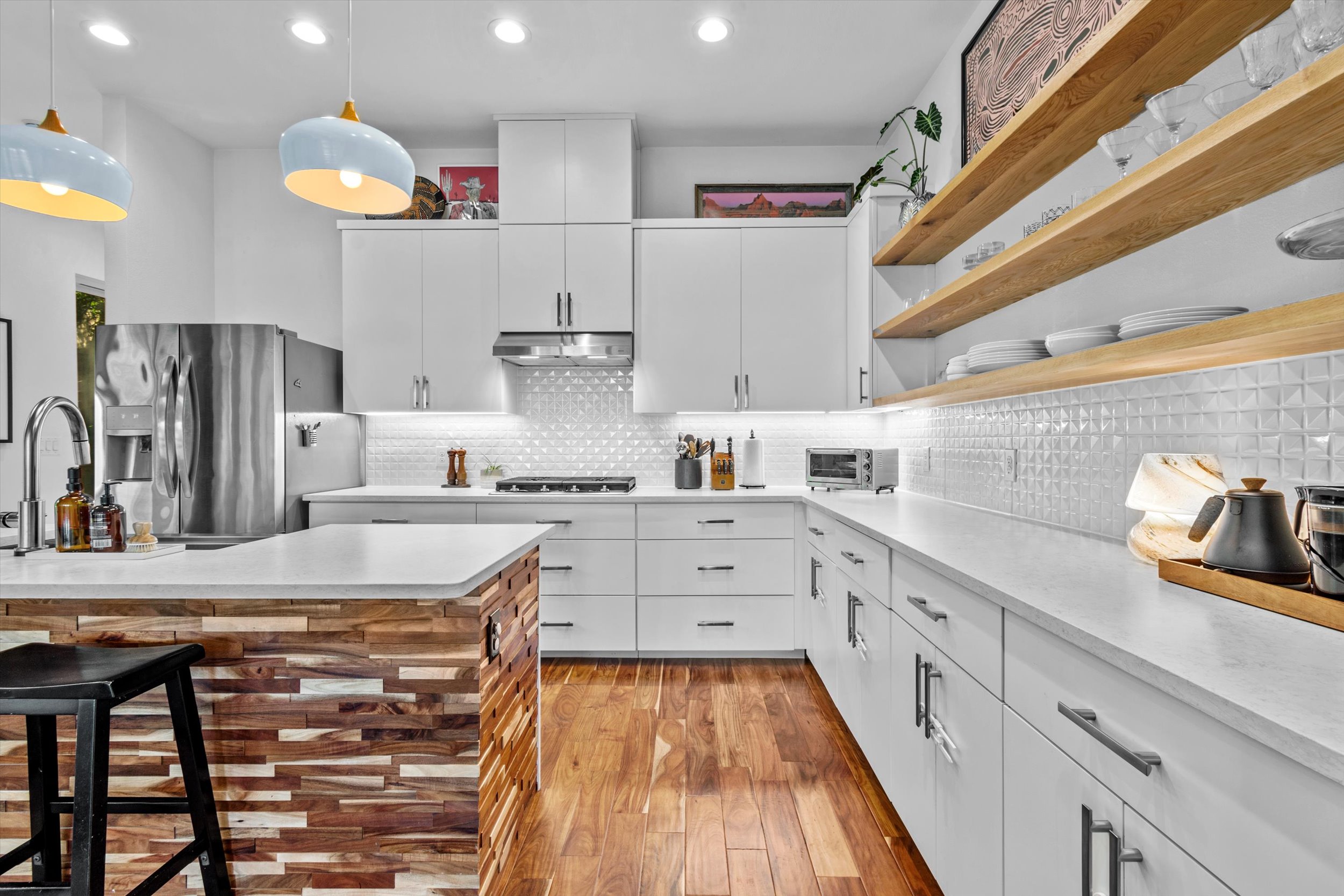2712 Oak Springs Drive, Unit A Austin, TX 78702 - Photo 2 of 38 a kitchen with cabinets and wooden floor