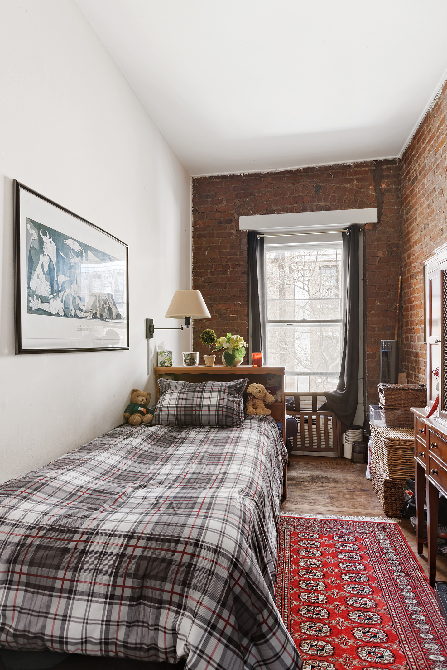 138 West 73rd Street Manhattan, NY 10023 - Photo 27 of 35 a bedroom with a bed and a window