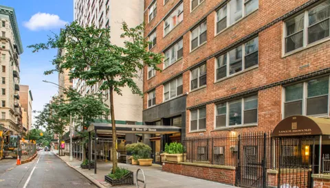 a view of a building with a tree