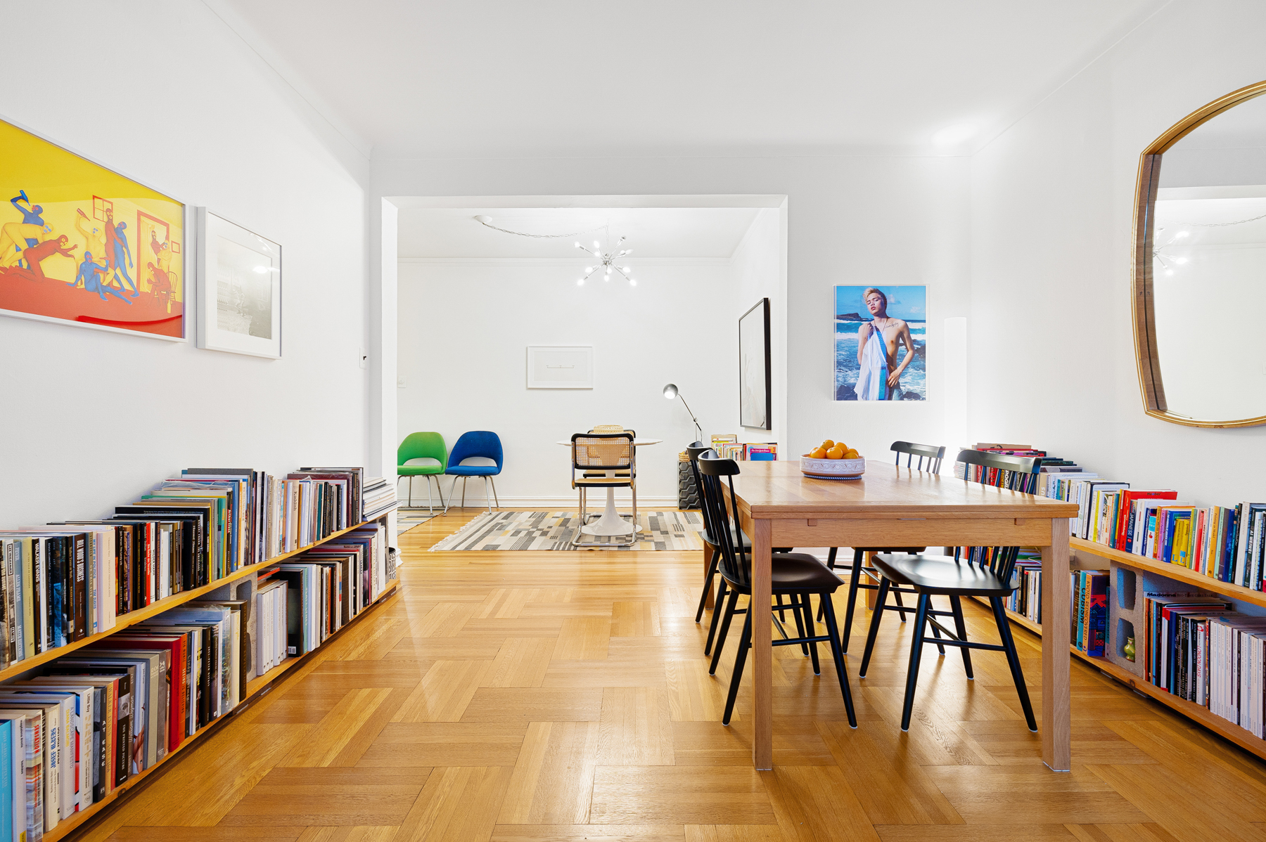 77-11 35th Avenue, Unit 3N Queens, NY 11372 - Photo 8 of 21 a living room with furniture and a book shelf
