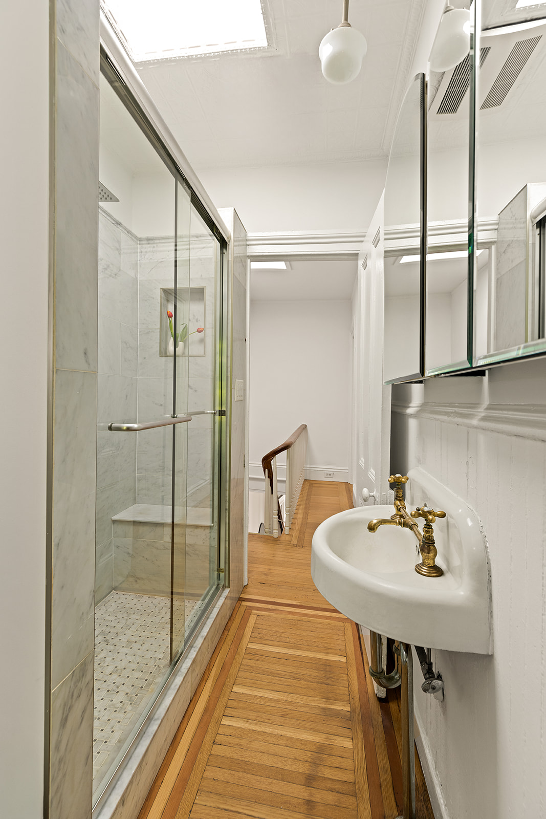 467 11th Street Brooklyn, NY 11215 - Photo 10 of 14 a bathroom with a sink and a mirror