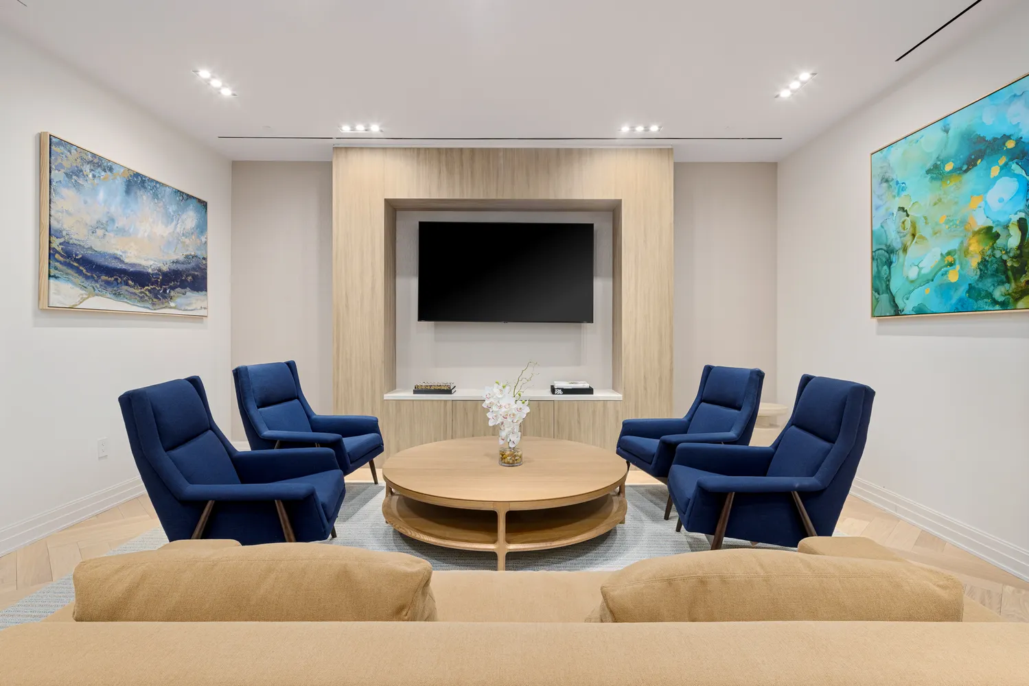 a living room with furniture and a flat screen tv