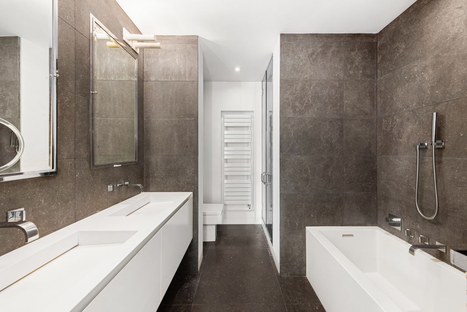 a bathroom with a bathtub and shower