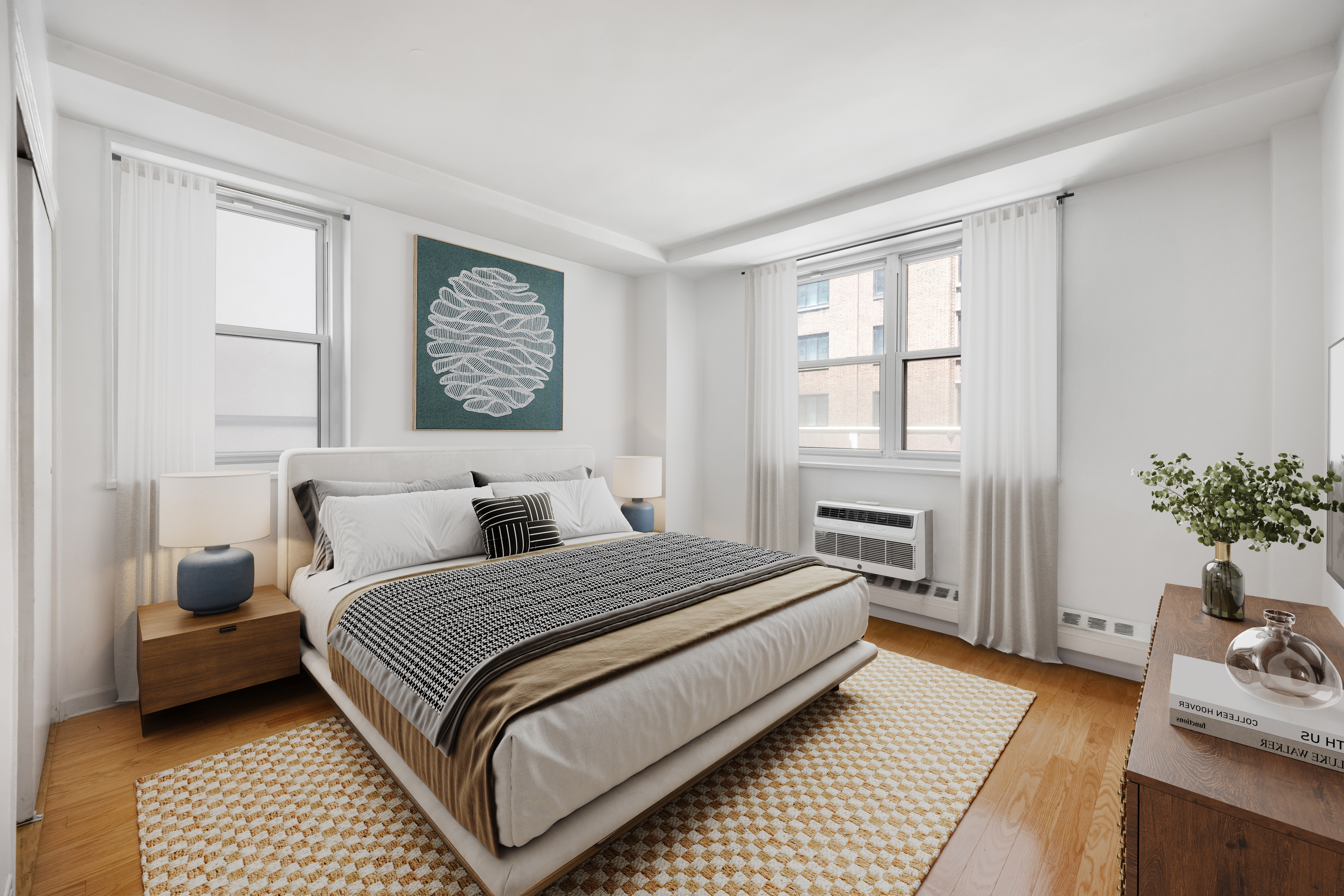 63 East 9th Street, Unit 6F Manhattan, NY 10003 - Photo 7 of 9 a bedroom with a large bed and a couch