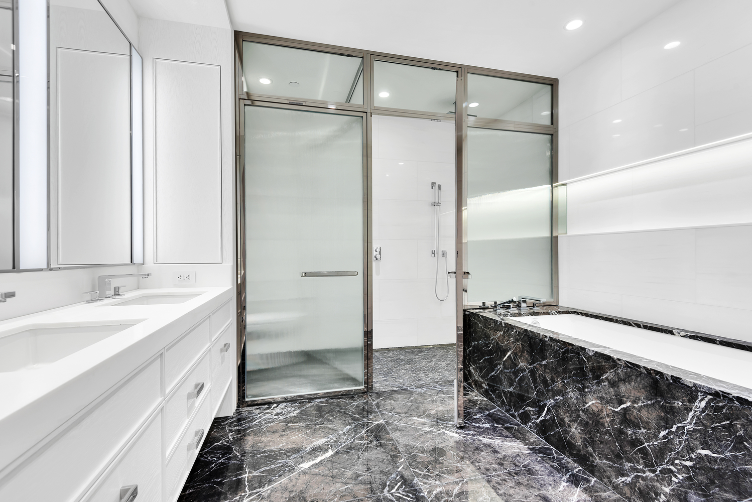 50 West 66th Street, Unit 7B Manhattan, NY 10023 - Photo 11 of 24 a bathroom with a double vanity sink and a mirror