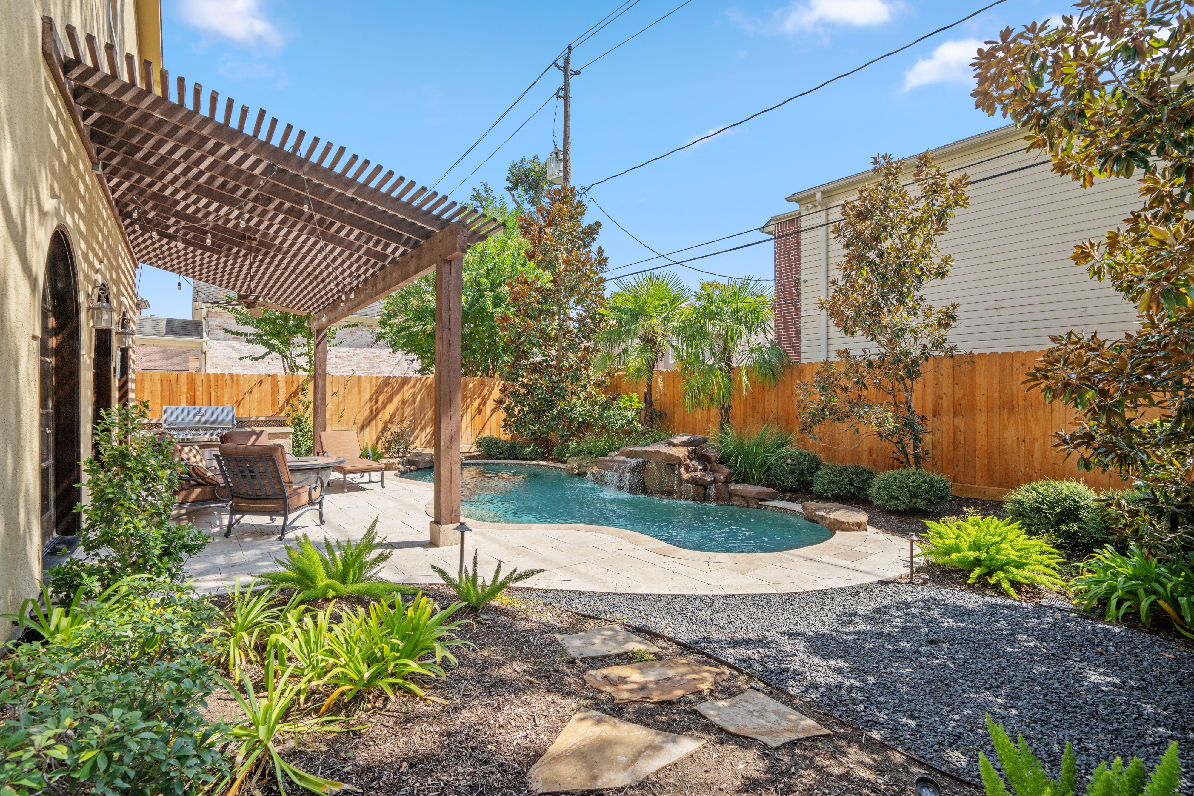 4219 Oberlin Street West University Place, TX 77005 - Photo 24 of 33 a view of a backyard with sitting area