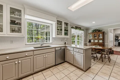 a kitchen with sink and window