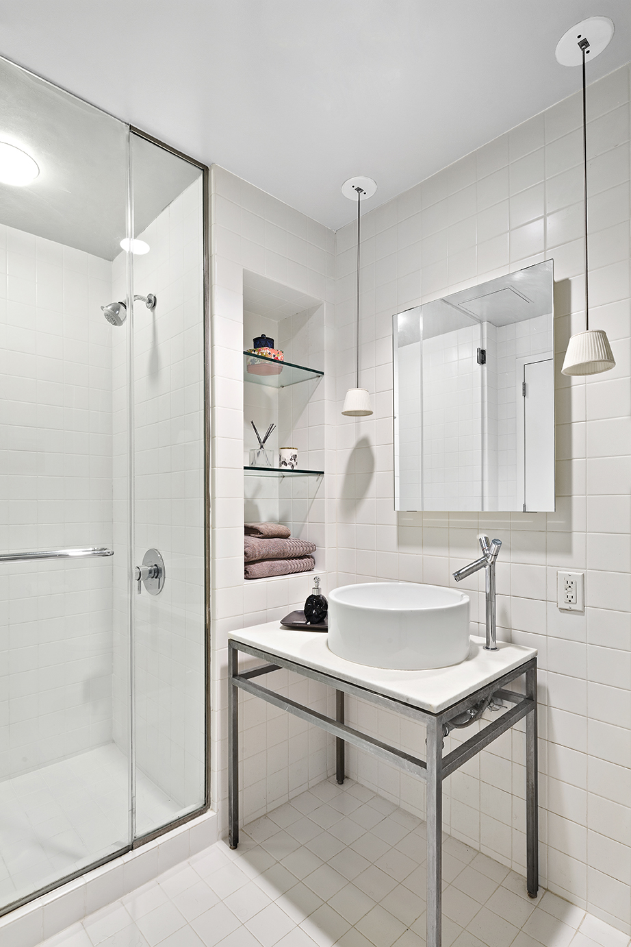 15 Broad Street, Unit 3214 Manhattan, NY 10005 - Photo 8 of 9 a bathroom with a sink and a mirror