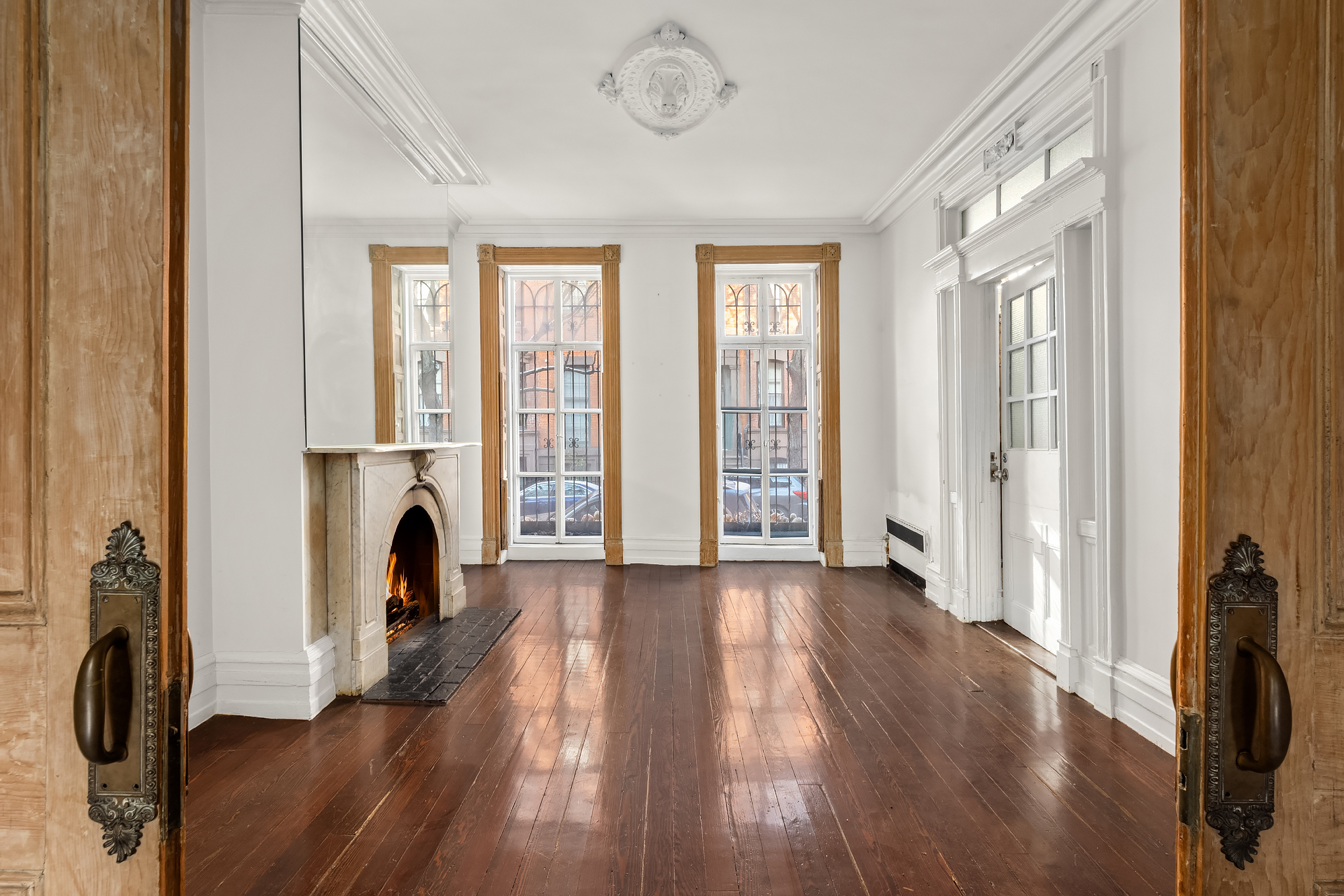 262 West 11th Street Manhattan, NY 10014 - Photo 15 of 27 a view of a livingroom with a furniture a fireplace and wooden floor
