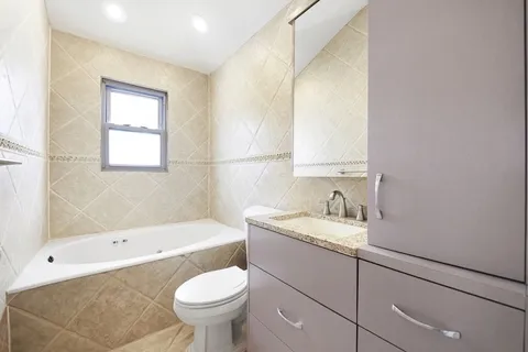 a bathroom with a sink toilet and bathtub