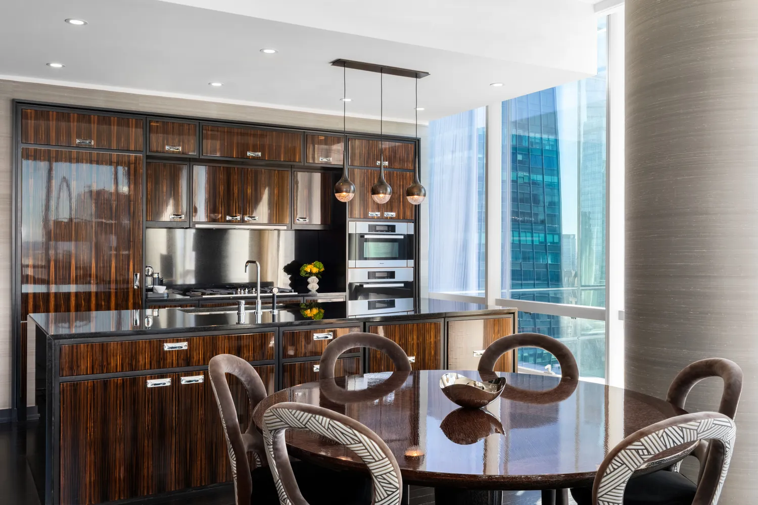 a kitchen with a table chairs and a stove