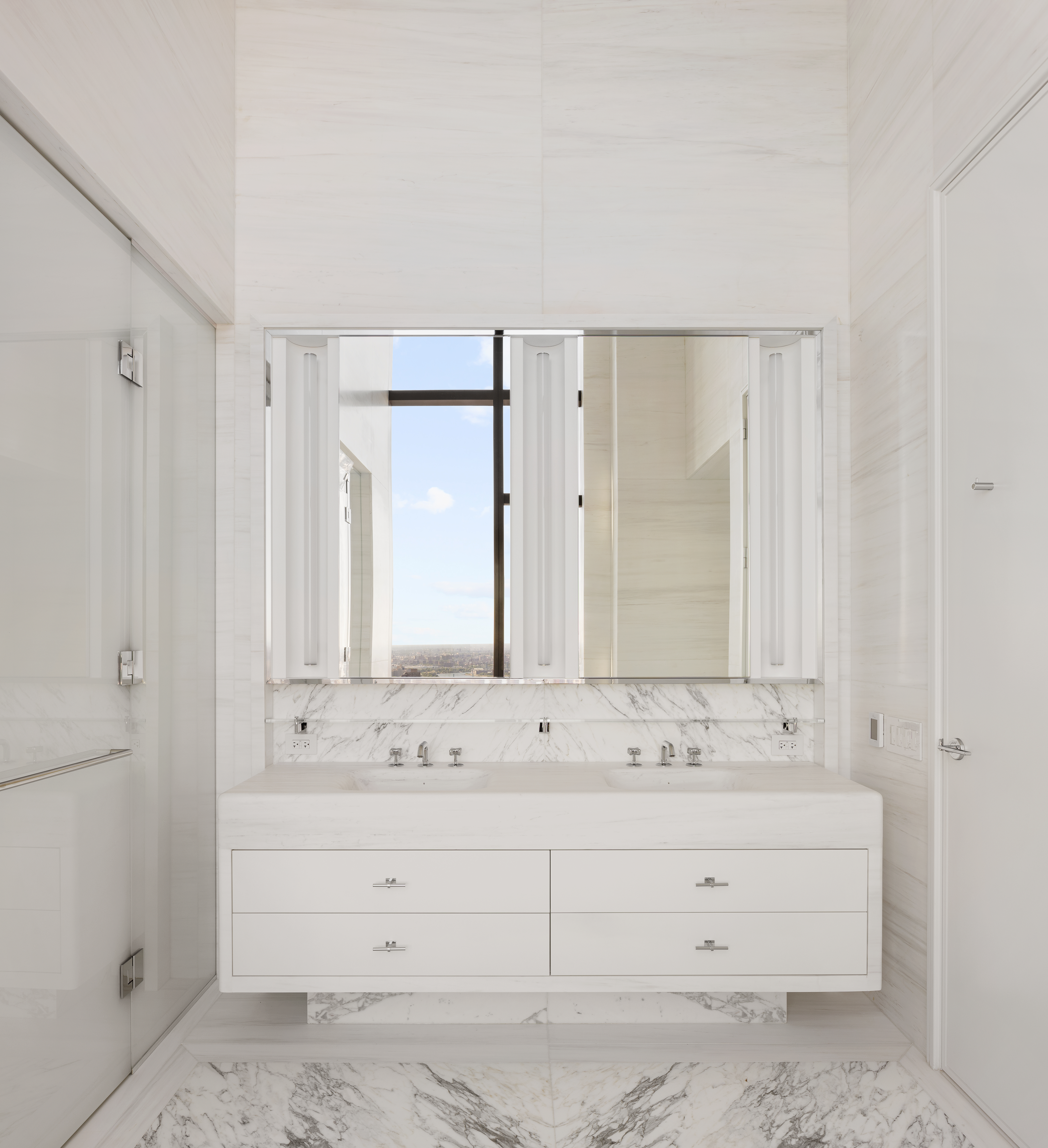 430 East 58th Street, Unit PH72 Manhattan, NY 10022 - Photo 11 of 26 a bathroom with a sink and a mirror