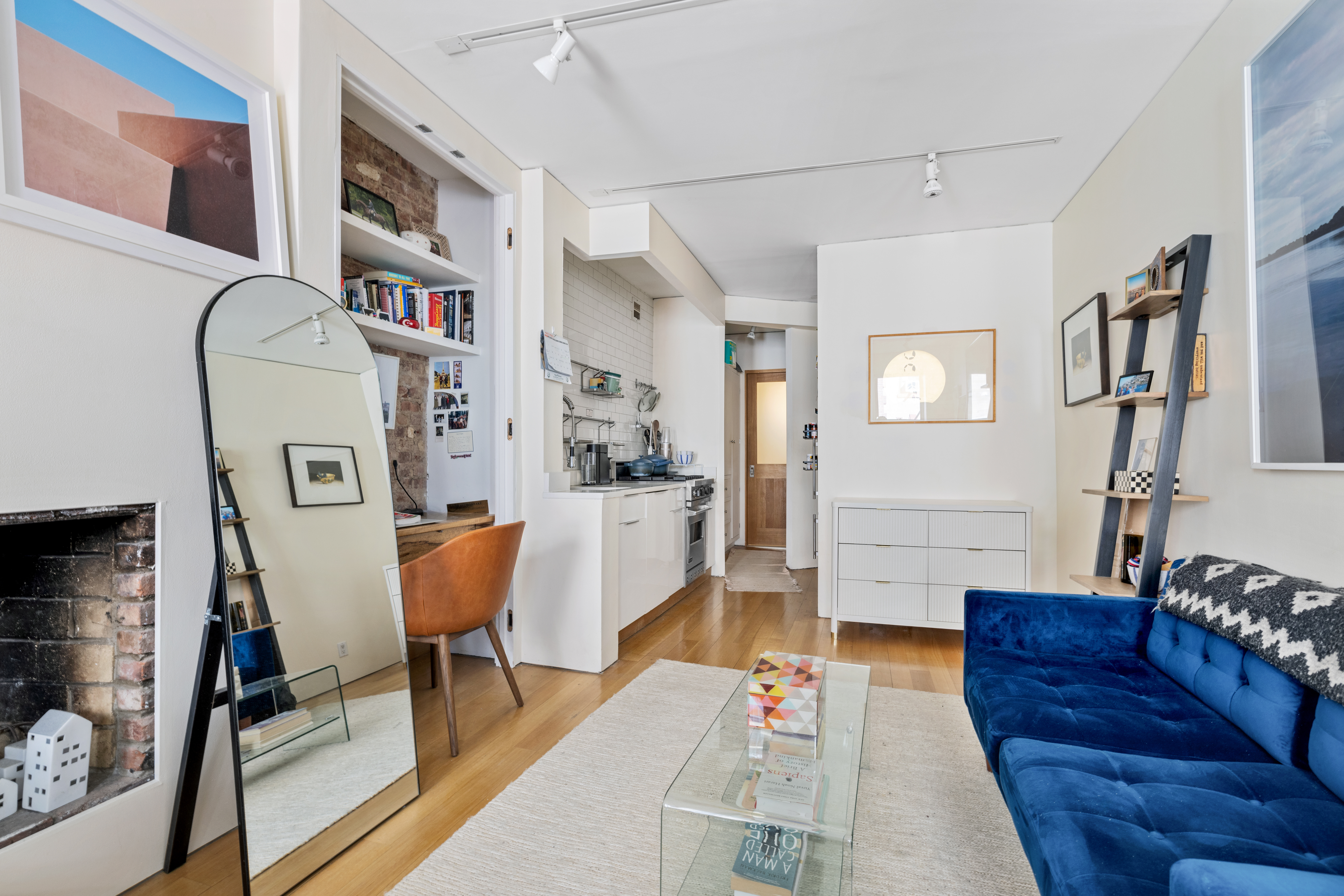 26 Cornelia Street, Unit 12 Manhattan, NY 10014 - Photo 2 of 7 a living room with furniture and a rug