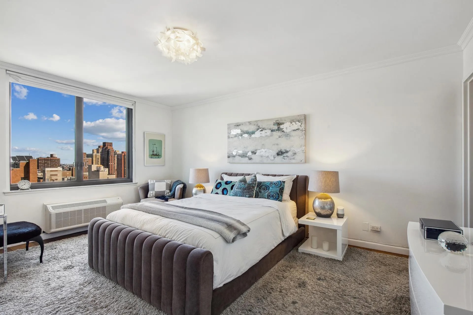 115 East 87th Street, Unit 18A Manhattan, NY 10128 - Photo 6 of 13 a bedroom with a bed and a painting on the wall