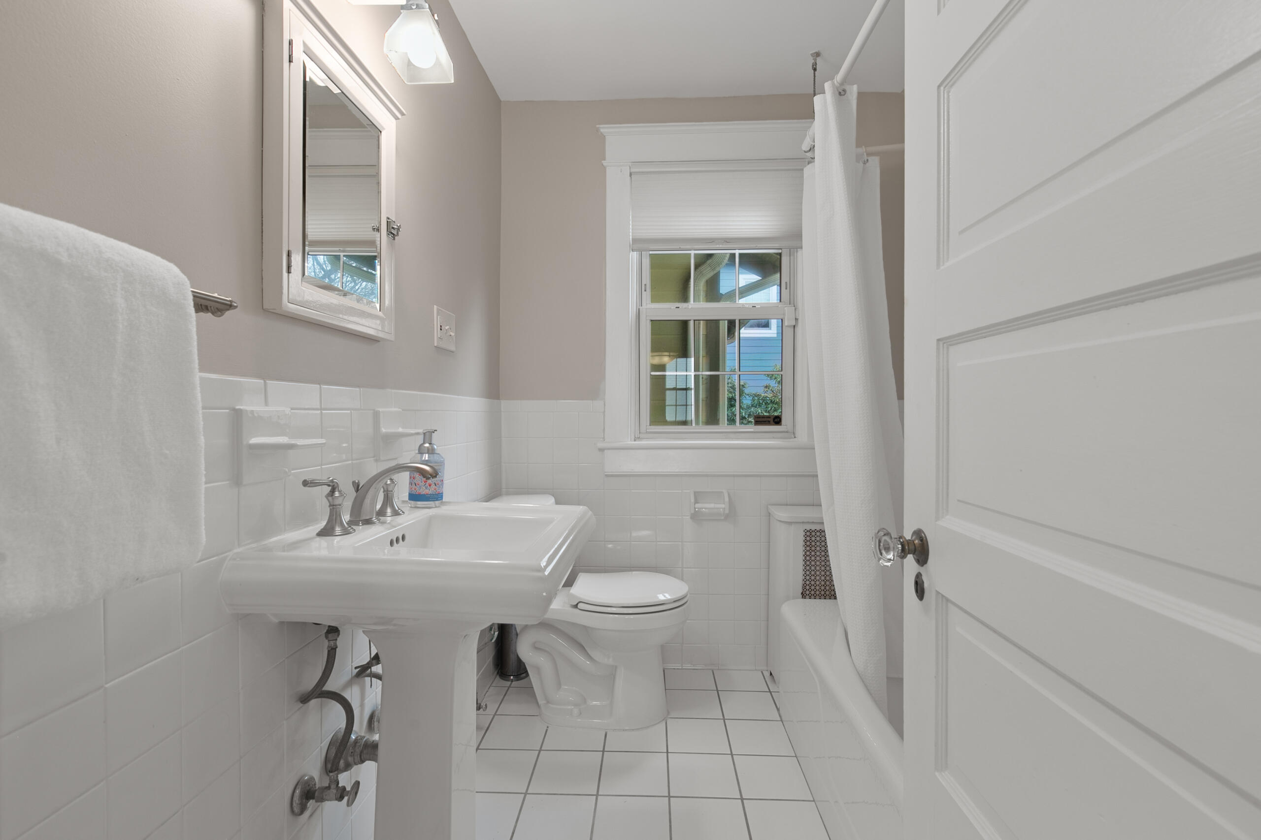 1908 Glen Ross Road Silver Spring, MD 20910 - Photo 33 of 63 a bathroom with a sink toilet and a mirror