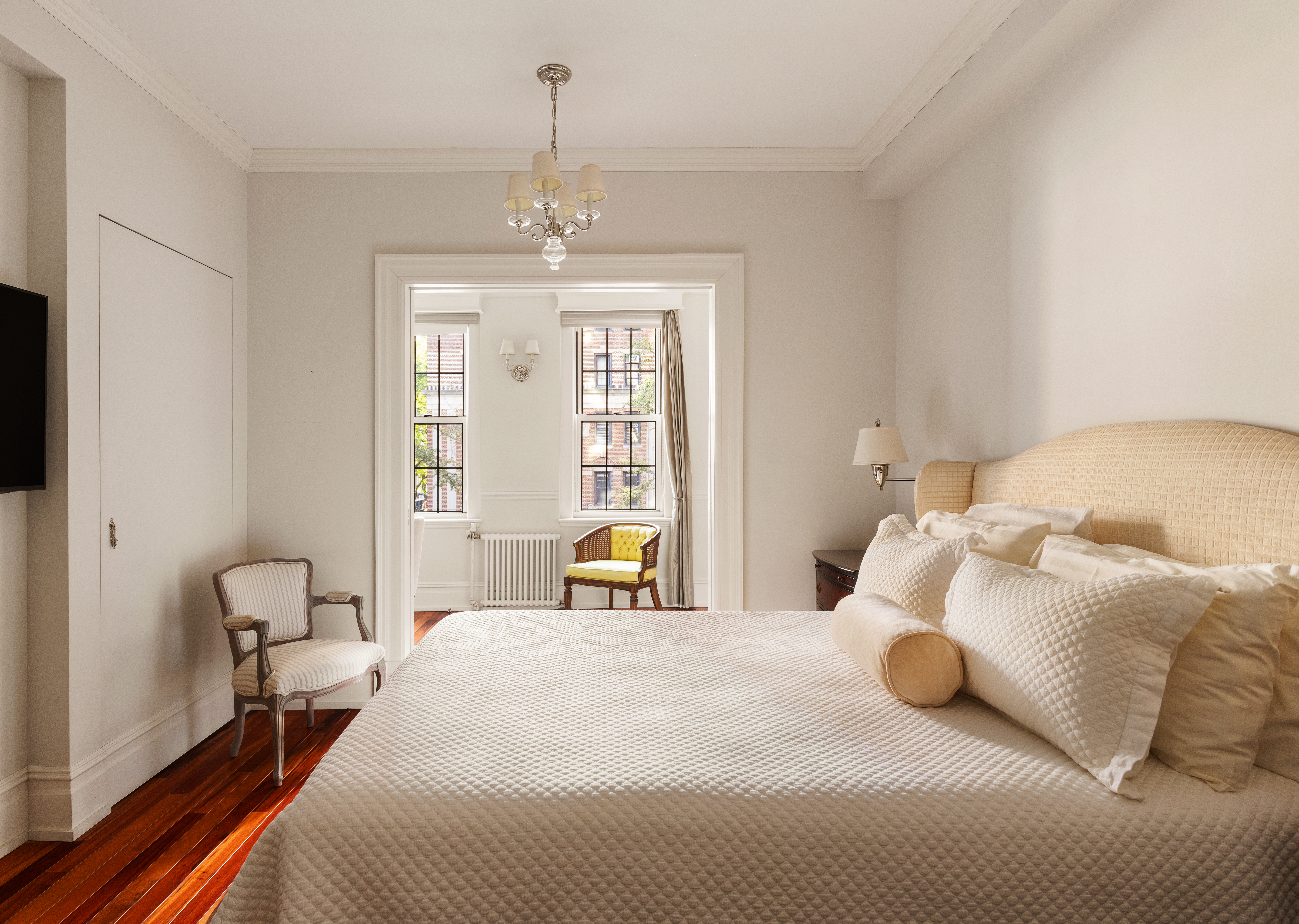 30 5th Avenue, Unit 3H Manhattan, NY 10011 - Photo 5 of 11 a bedroom with a bed and wooden floor